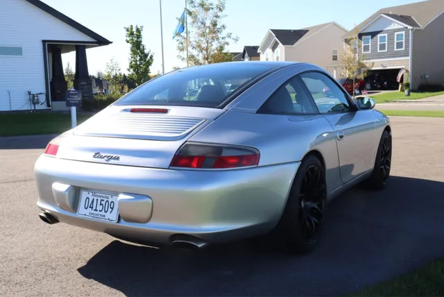 Rear three-quarter view of the silver 2003 911 Targa from the auction listing